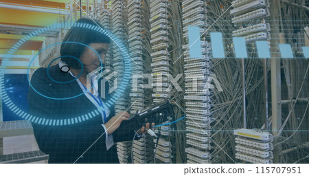 Caucasian woman with a headset examines server cables Caucasian woman with a headset examines server cables 115707951