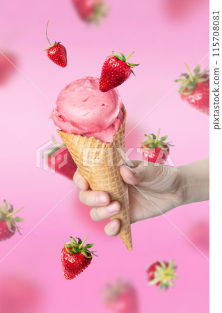 Composition levitation Strawberry ice cream waffle cone with Strawberries, Woman hand holding waffle con on pink background, In the air, vertical food tasty banner Composition levitation Strawberry ice cream waffle cone with Strawberries, Woman hand holding waffle con on pink background, In the air, vertical food tasty banner 115708081