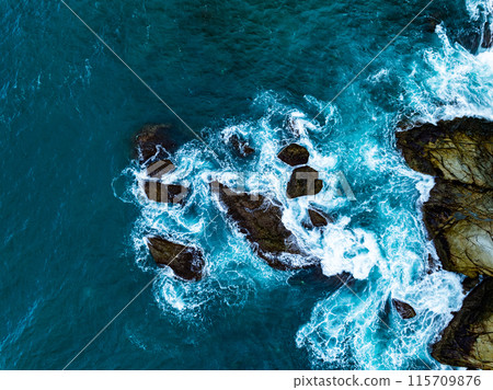 Amazing seascape view seashore and big waves crashing on rocks, Aerial view waves sea surface in Phuket island Thailand,Travel and business tour website background concept Amazing seascape view seashore and big waves crashing on rocks, Aerial view waves sea surface in Phuket island Thailand,Travel and business tour website background concept 115709876