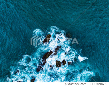 Amazing seascape view seashore and big waves crashing on rocks, Aerial view waves sea surface in Phuket island Thailand,Travel and business tour website background concept 115709878