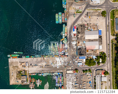 Fishing boats under sunlight in coastal of General Santos Fish Port Complex. Mindanao, Philippines. Fishing boats under sunlight in coastal of General Santos Fish Port Complex. Mindanao, Philippines. 115712284