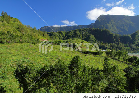 Mountain scenery around the village of Salazy, the base of the Cirque de Salazy, a World Heritage Site on the French overseas island of Reunion 115712389
