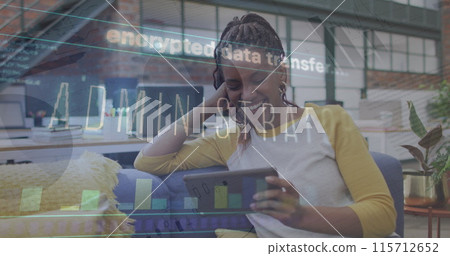 Image of data processing over african american businesswoman using tablet Image of data processing over african american businesswoman using tablet 115712652