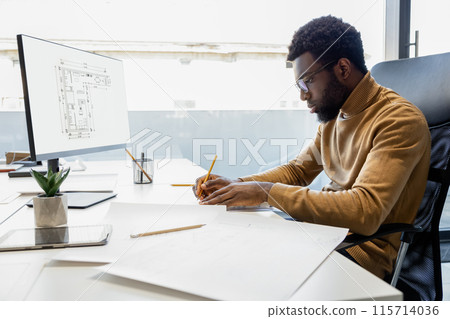 Man architect using engineering computer programs for creating construction project in his workplace Man architect using engineering computer programs for creating construction project in his workplace 115714036
