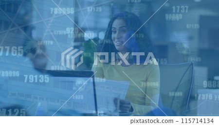 Image of numbers changing over happy biracial woman in office Image of numbers changing over happy biracial woman in office 115714134