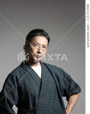 Portrait of a man wearing a work uniform Senior craftsman Image 115715466