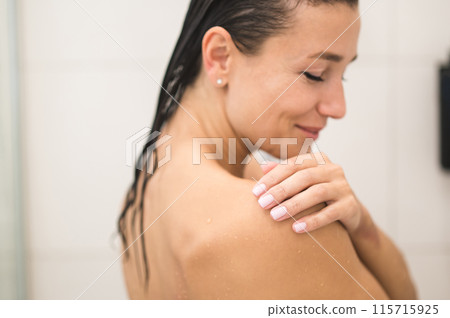 Waist up picture of a woman in the shower Waist up picture of a woman in the shower 115715925