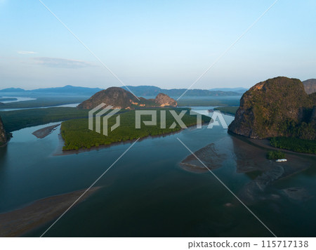Amazing mountains abundant mangrove forest,Aerial view of forest trees in sunrise or sunset sky over sea Amazing mountains abundant mangrove forest,Aerial view of forest trees in sunrise or sunset sky over sea 115717138