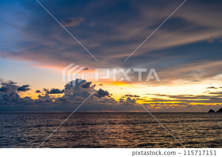 Colorful sky clouds over sea landscape background Colorful sky clouds over sea landscape background 115717151