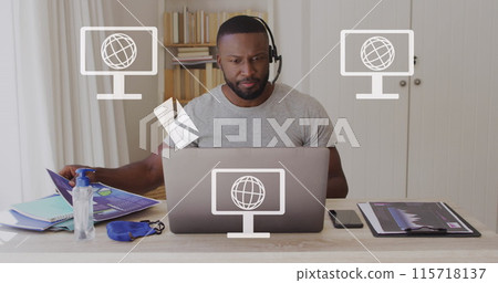 Image of screens with globes icons over african american man using laptop Image of screens with globes icons over african american man using laptop 115718137
