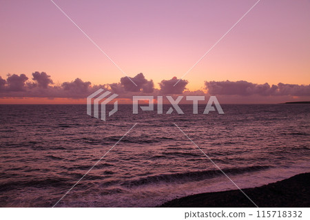 A view of the Indian Ocean sunrise and sunset from the coast of Saint-Denis, the capital of the French overseas department of Reunion A view of the Indian Ocean sunrise and sunset from the coast of Saint-Denis, the capital of the French overseas department of Reunion 115718332