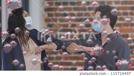 Image of covid 19 cells floating over people in face masks, touching elbows in office 115718497