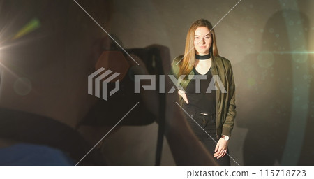 Image of light over caucasian male photographer and female model taking photos Image of light over caucasian male photographer and female model taking photos 115718723