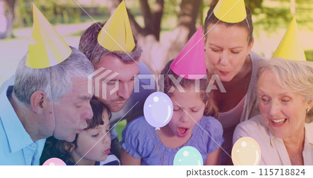 Image of balloons over happy caucasian family at party Image of balloons over happy caucasian family at party 115718824
