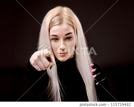 A woman stabbing her index finger straight in 115719482