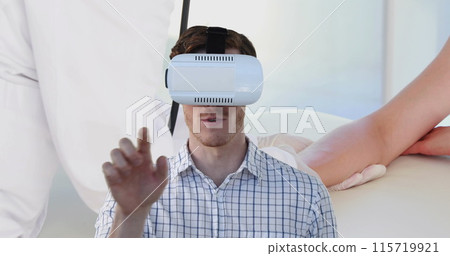 Image of man using vr headset over doctor and female patient 115719921