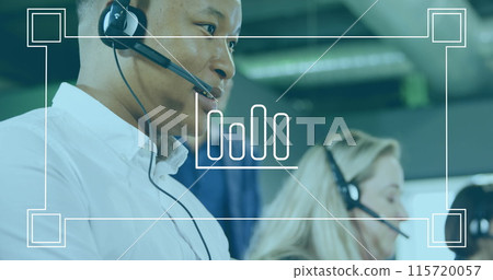 Multi-ethnic call center team works under a graph in a digital composite image. 115720057