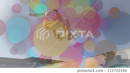 Image of colourful spots over caucasian man skateboarding 115720166