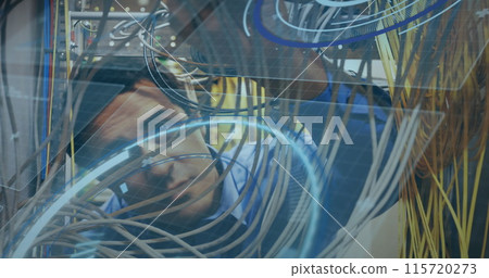 Image of scope scanning and data processing over caucasian it man computer server 115720273