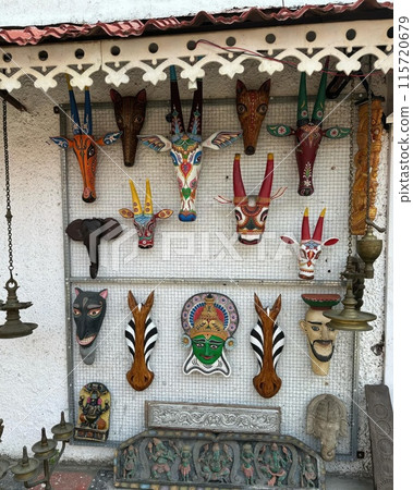 The faces of various animals are carved in bright colors on the white walls. The faces of various animals are carved in bright colors on the white walls. 115720679