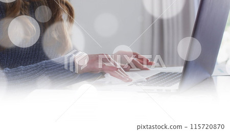 Image of white spots over caucasian woman wiping laptop at home Image of white spots over caucasian woman wiping laptop at home 115720870
