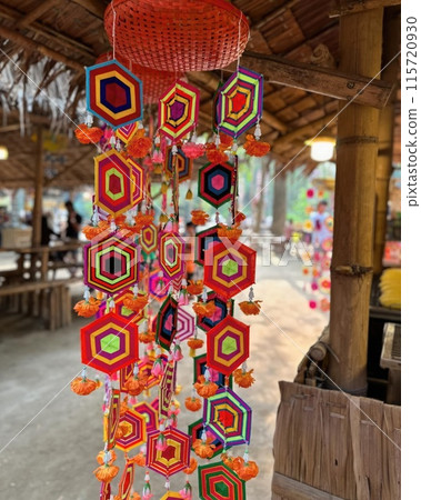 Colorful paper lanterns hanging on the wall of a rural house 115720930