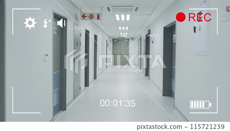 Digital camera records a hospital corridor in 4k with on-screen icons and timer. 115721239