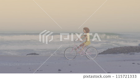 Spots of light against african american woman riding a bicycle at the beach Spots of light against african american woman riding a bicycle at the beach 115721333