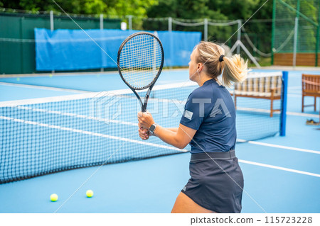 Professional female tennis player playing the tennis on outside court 115723228