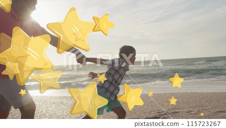 Image of stars over biracial man with grandson at beach Image of stars over biracial man with grandson at beach 115723267