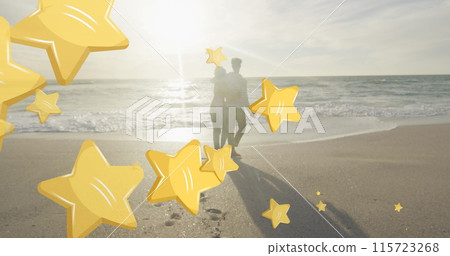 Image of stars over biracial couple at beach Image of stars over biracial couple at beach 115723268