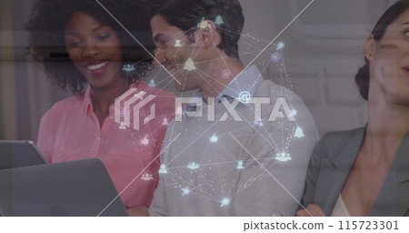 Image of globe of digital icons over mid section of diverse colleagues using electronic devices 115723301