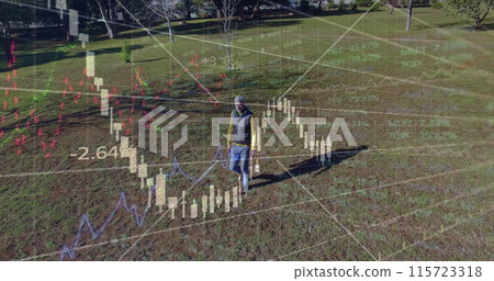 Image of financial data processing over caucasian man walking in park Image of financial data processing over caucasian man walking in park 115723318