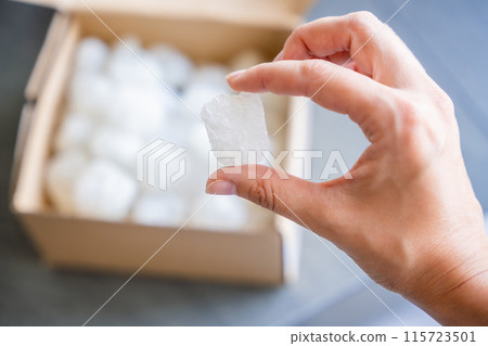 Eco packaging of parcels and white biodegradable filler. Box is filled with a filler safety for environment. Delivery of goods, parcels, delivery service, nature protection and recycling concept Eco packaging of parcels and white biodegradable filler. Box is filled with a filler safety for environment. Delivery of goods, parcels, delivery service, nature protection and recycling concept 115723501