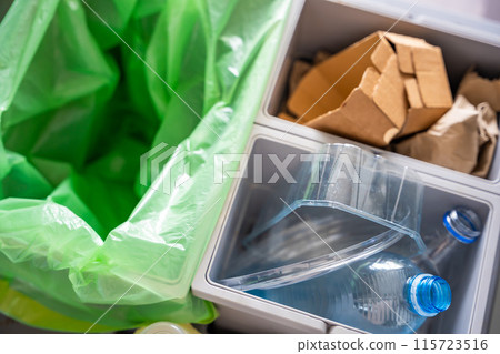 Household bins for waste sorting in the kitchen for recycle. Plastic, paper, bio and mixed waste. Sorting waste at home concept Household bins for waste sorting in the kitchen for recycle. Plastic, paper, bio and mixed waste. Sorting waste at home concept 115723516