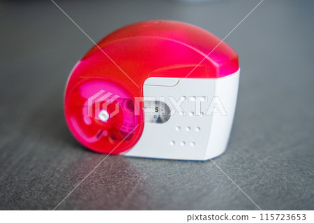 Close up view of medicine dry powder inhaler for treatment asthma or COPD diseases. Pharmaceutical product is used to treat lung inflammation and prevent asthma attack. 115723653