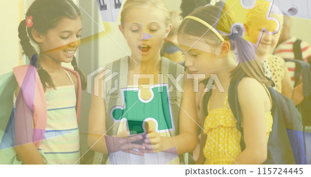 Image of puzzle pieces over diverse schoolchildren using smartphone 115724445