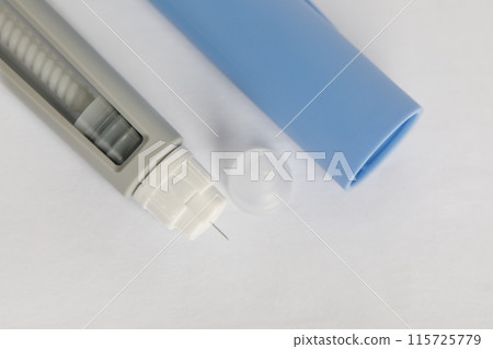 Semaglutide injecting pen on a white background, macro. Needle macro 115725779
