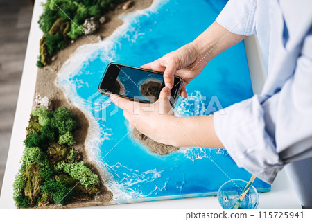 Artist Photographing Epoxy Resin Artwork for Online Sale 115725941
