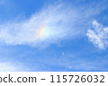 Clouds and iridescent clouds floating in the blue sky 115726032