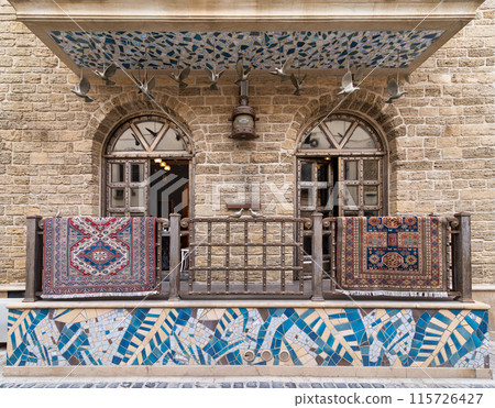 Old Town Baku Building With Ornate Balcony and hanged Rugs Old Town Baku Building With Ornate Balcony and hanged Rugs 115726427