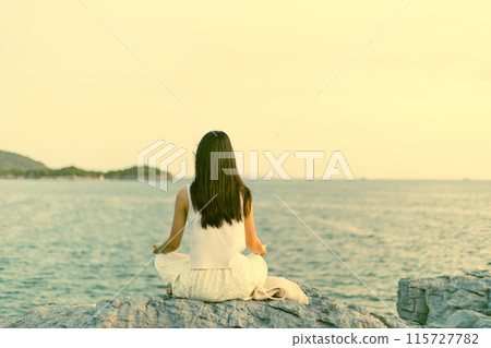 Woman Looking at the Sunset Woman Looking at the Sunset 115727782