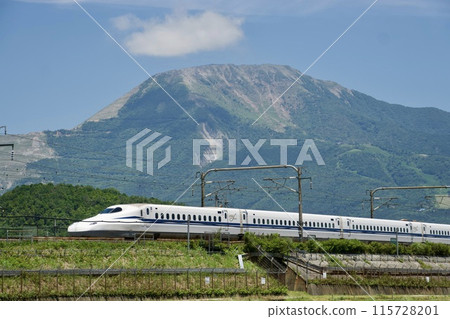 A Shinkansen train running under a blue sky with Mt. Ibuki in the background in summer A Shinkansen train running under a blue sky with Mt. Ibuki in the background in summer 115728201