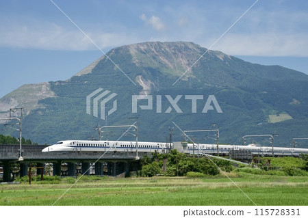 A bullet train running under clear skies with Mt. Ibuki in the background A bullet train running under clear skies with Mt. Ibuki in the background 115728331