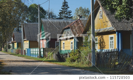 A village street with houses in Eastern Europe. 115728503