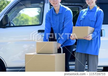 Asian male and female delivery drivers carrying luggage 115728733