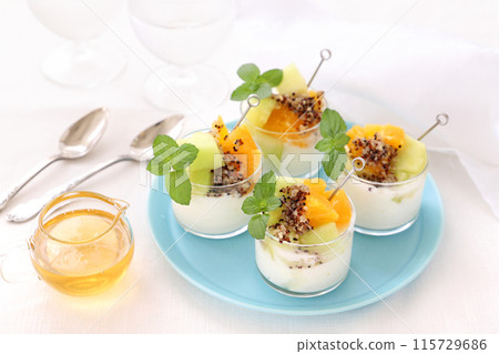 Yogurt topped with quinoa and fruit Yogurt topped with quinoa and fruit 115729686