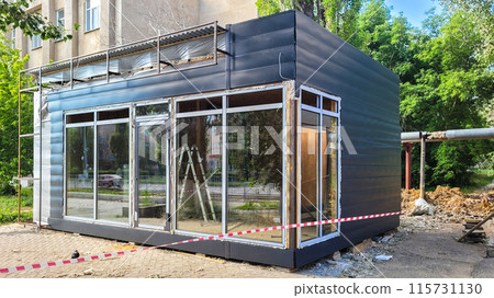 Construction of a street shopping pavilion for a store, all stages of construction, detailed overview Construction of a street shopping pavilion for a store, all stages of construction, detailed overview 115731130
