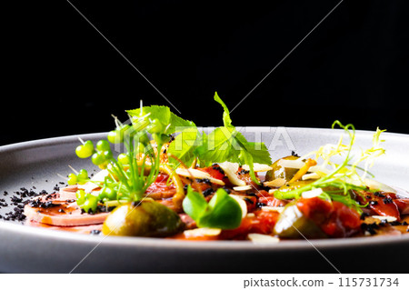 Beef tongue with sauce and vegetables on a white plate Beef tongue with sauce and vegetables on a white plate 115731734
