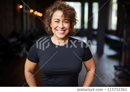 Mature Joy: Cheerful 55-Year-Old Woman in Gym Wear Mature Joy: Cheerful 55-Year-Old Woman in Gym Wear 115732362